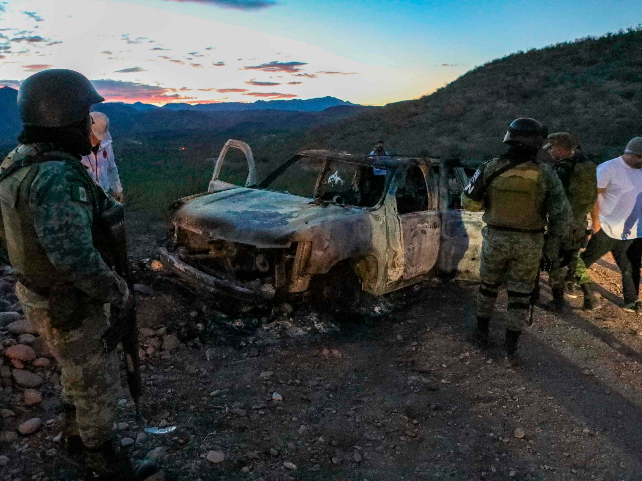The burned wreckage of a car where some of the nine murdered members of a family were killed during an ambush in Bavispe, Sonora mountains, Mexico