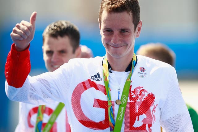 Gold medaltist Alistair Brownlee of Great Britain celebrates on the podium