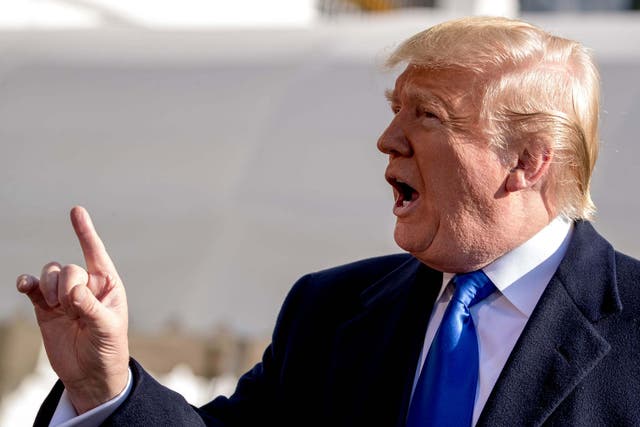 Donald Trump tells a reporter to be quiet as he speaks on the South Lawn of the White House in Washington on Friday 8 November 2019, before boarding Marine One for a short trip to Andrews Air Force Base, Maryland and then on to Georgia to meet with supporters