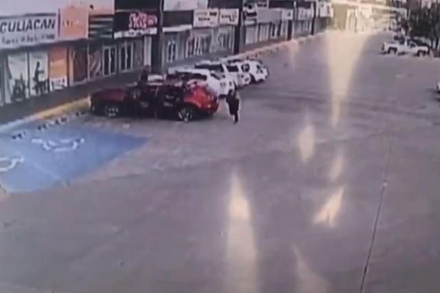 CCTV from the scene appears to show a group of armed men jumping out of a car and firing on a neighbouring vehicle at a strip mall in Culiacan