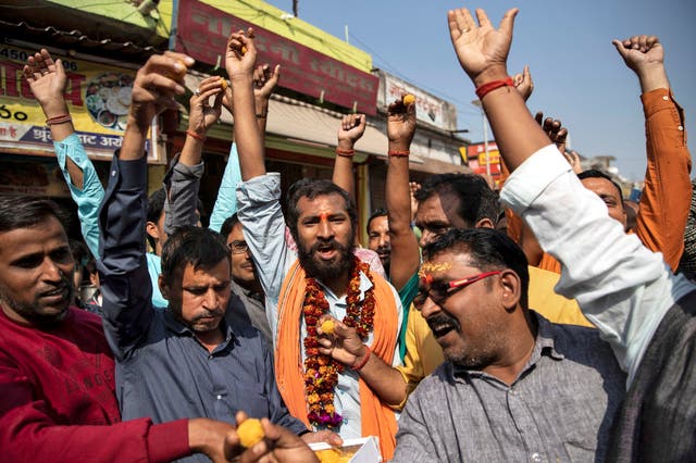 Hindu devotees celebrate after the Supreme Court's verdict on the disputed religious site in Ayodhya, India