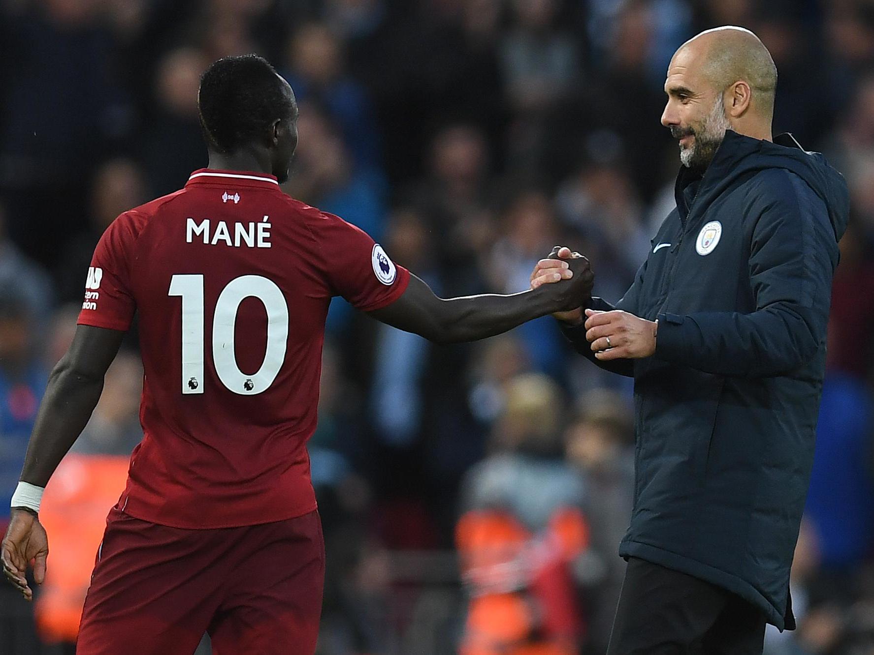Manchester City's Pep Guardiola shakes hands with Liverpool's Sadio Mane