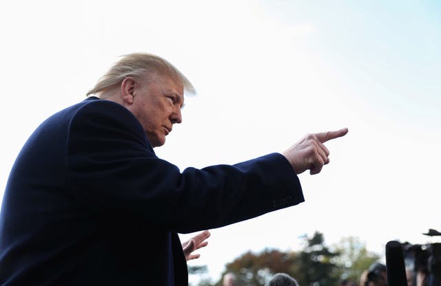 Donald Trump talks to reporters as he departs for travel to Georgia from the South Lawn of the White House