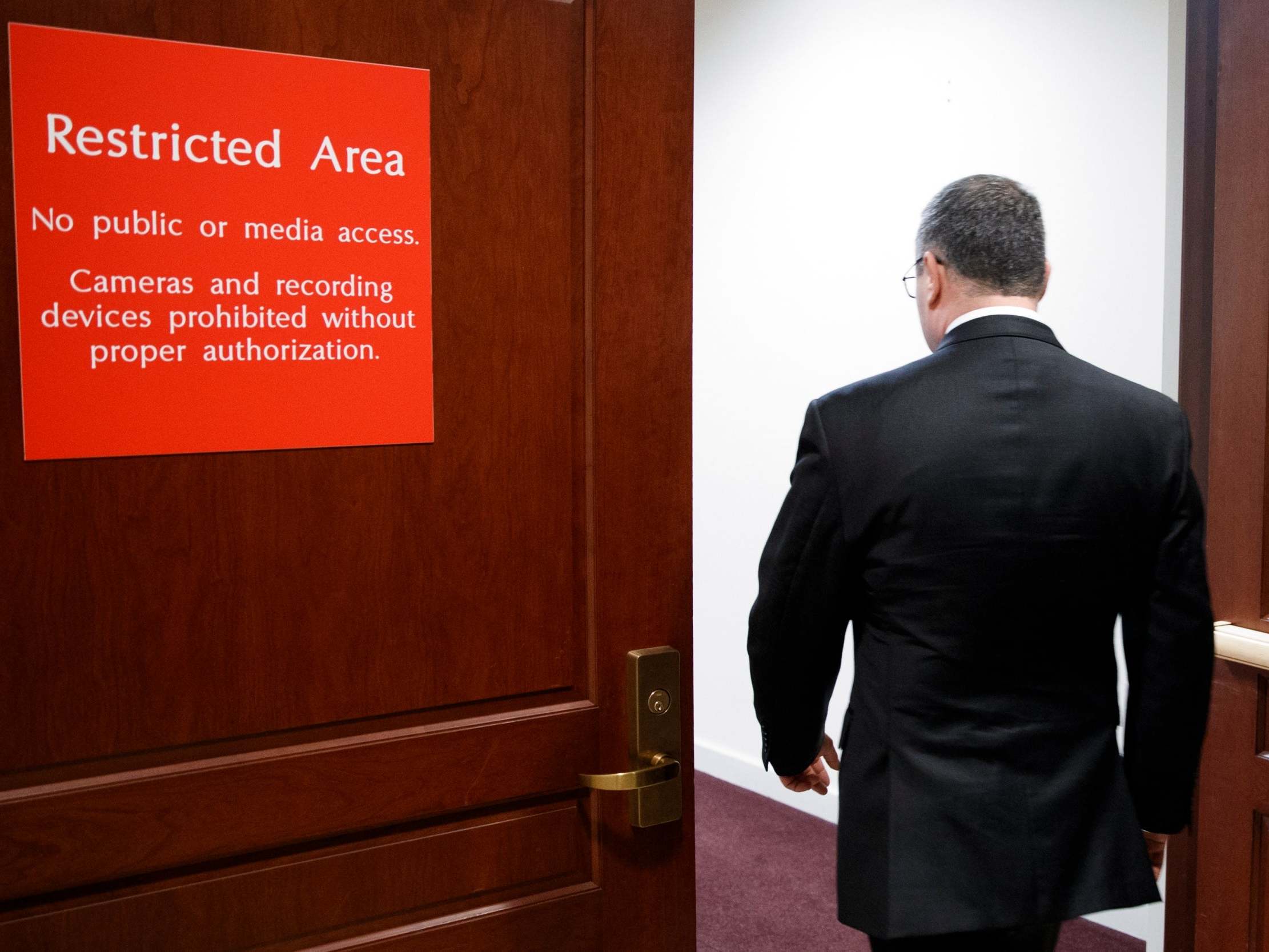 Lieutenant Colonel Alexander Vindman enters the impeachment inquiry hearing to give evidence behind closed doors