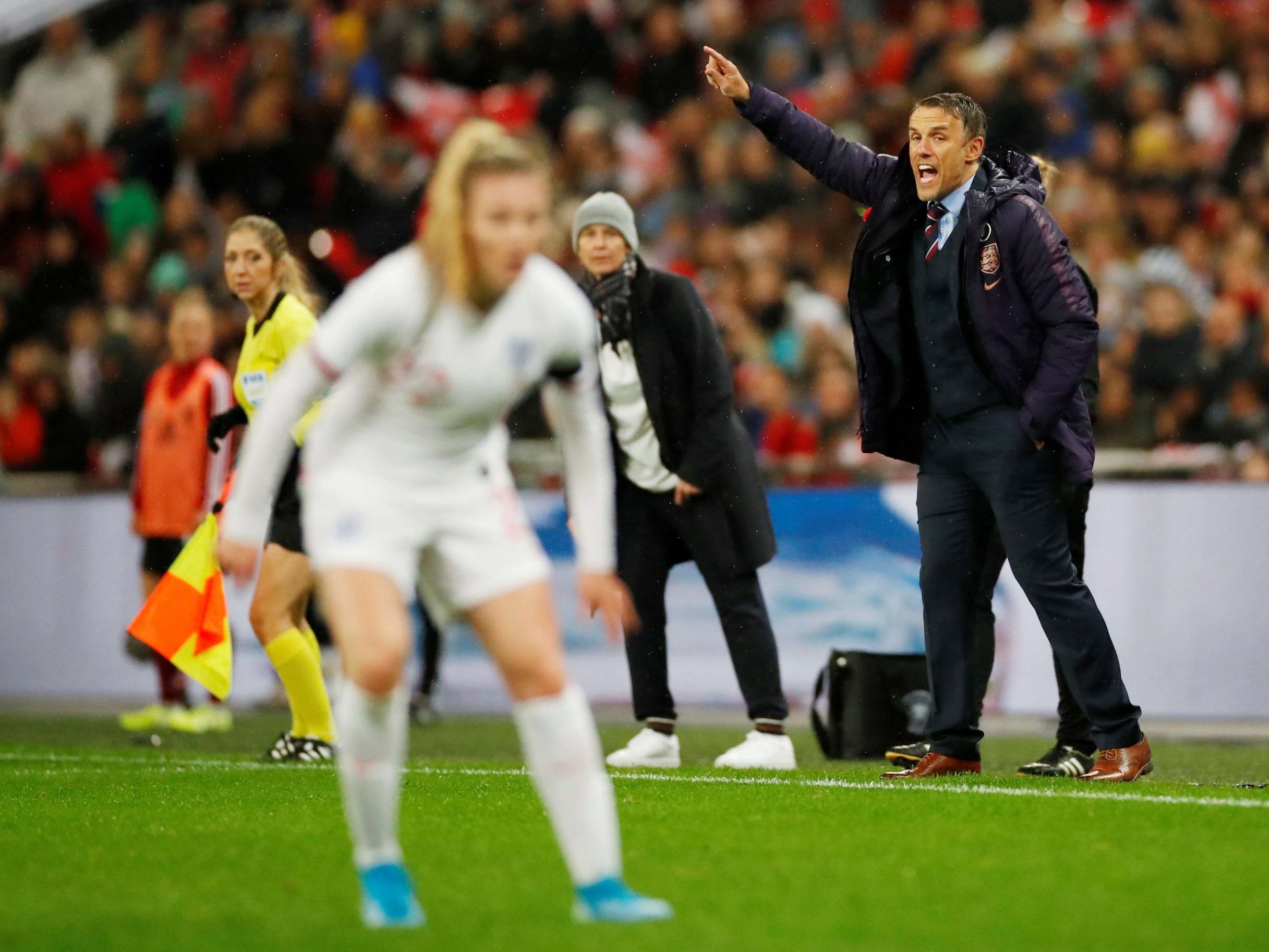 Phil Neville directs from the touchline at Wembley