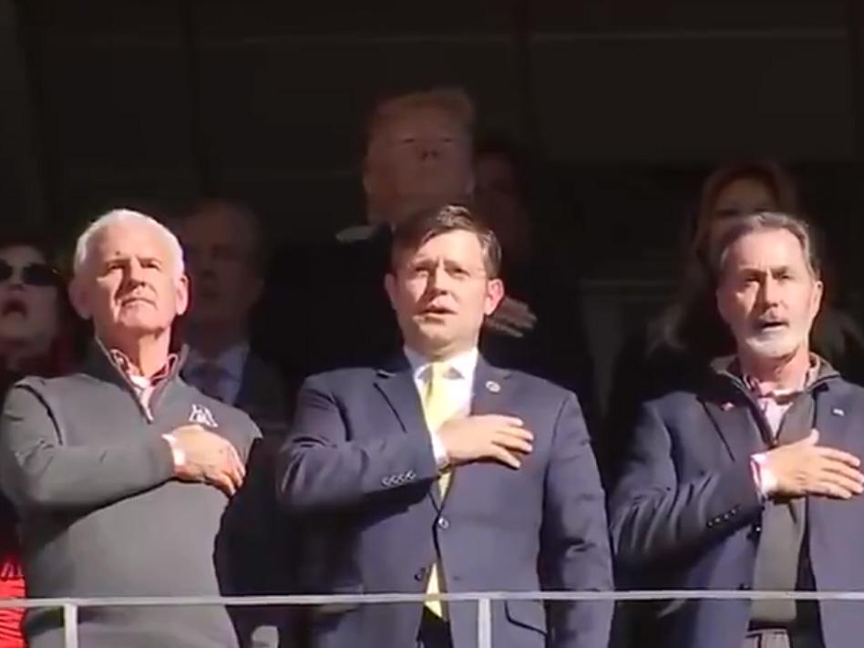 Trump appears to forget words to US national anthem at college football game