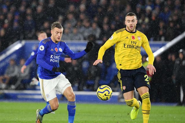 Calum Chambers of Arsenal and Jamie Vardy of Leicester City