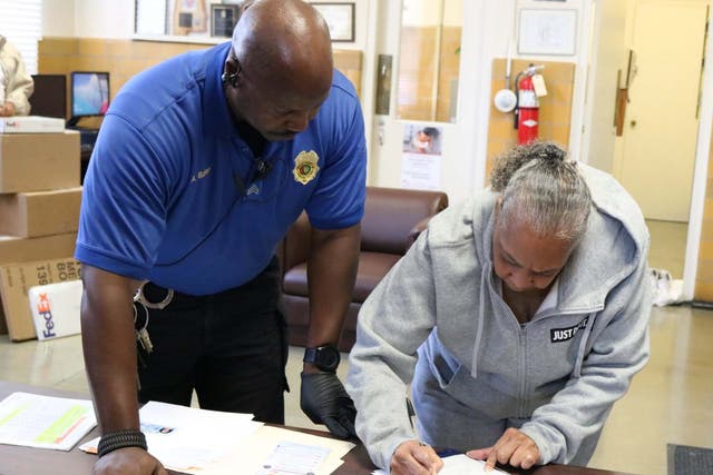 Grandmother Geneva Cooley signs papers to be released from Julia Tutwiler Prison