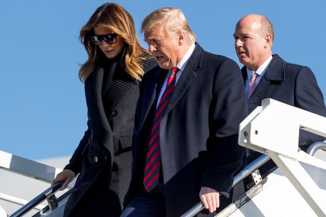 Donald Trump and the first lady, Melania Trump, arriving at Tuscaloosa airport in Alabama with congressman Robert Aderholt