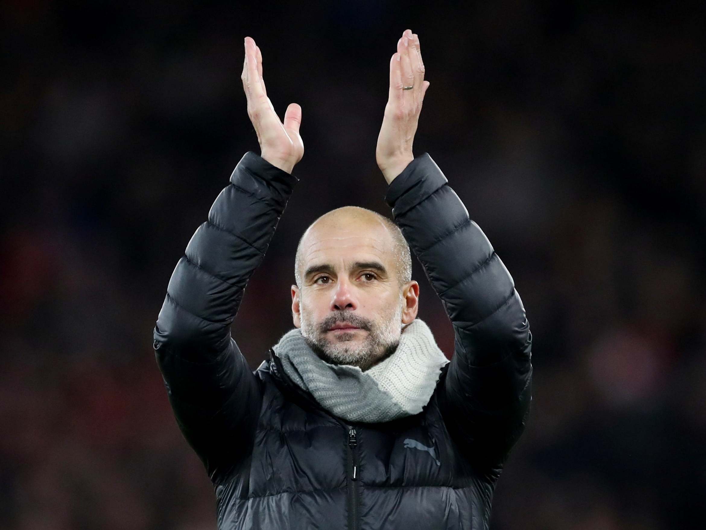 Manchester City manager Pep Guardiola applauds the fans after the match