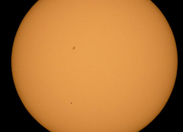 <p>The planet Mercury is seen in silhouette, lower third of image, as it transits across the face of the sun Monday, May 9, 2016, as viewed from Boyertown, Pennsylvania</p>