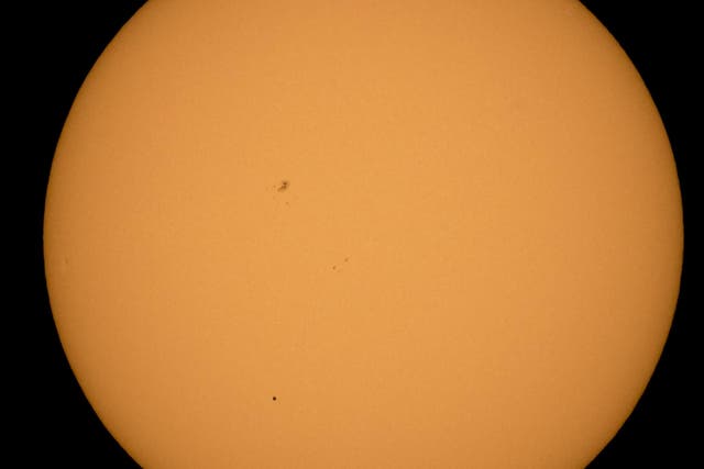 <p>The planet Mercury is seen in silhouette, lower third of image, as it transits across the face of the sun Monday, May 9, 2016, as viewed from Boyertown, Pennsylvania</p>