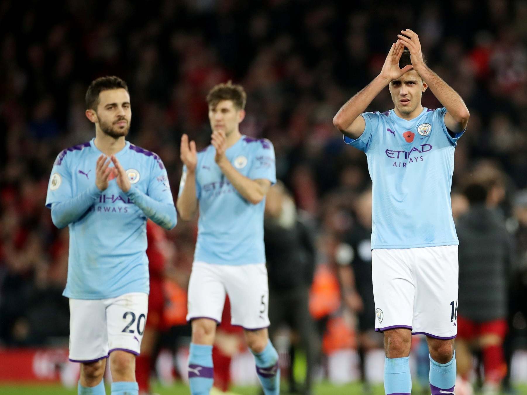 Manchester City's Rodri and Bernardo Silva applaud the fans after the match