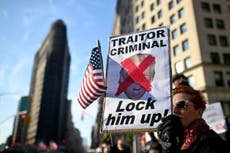 Crowd boos and chants 'lock him up' at Trump at Veterans Day speech