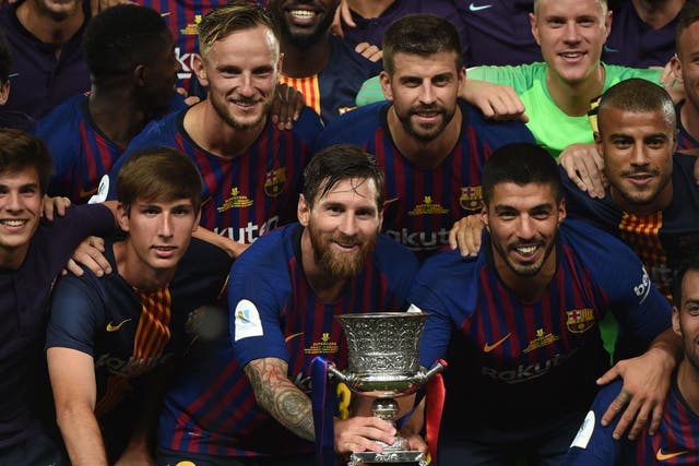 Lionel Messi and his Barcelona teammates with the Spanish Super Cup