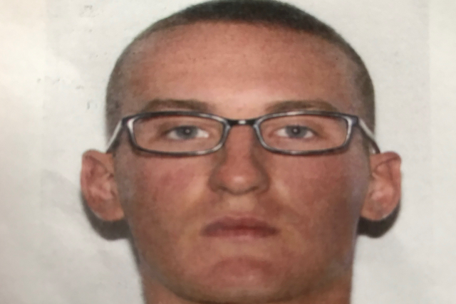 An image of 22-year-old Marine Michael Alexander Brown, accused of abandoning his post and murdering his mother's boyfriend nearly 300 miles away from where he was based.