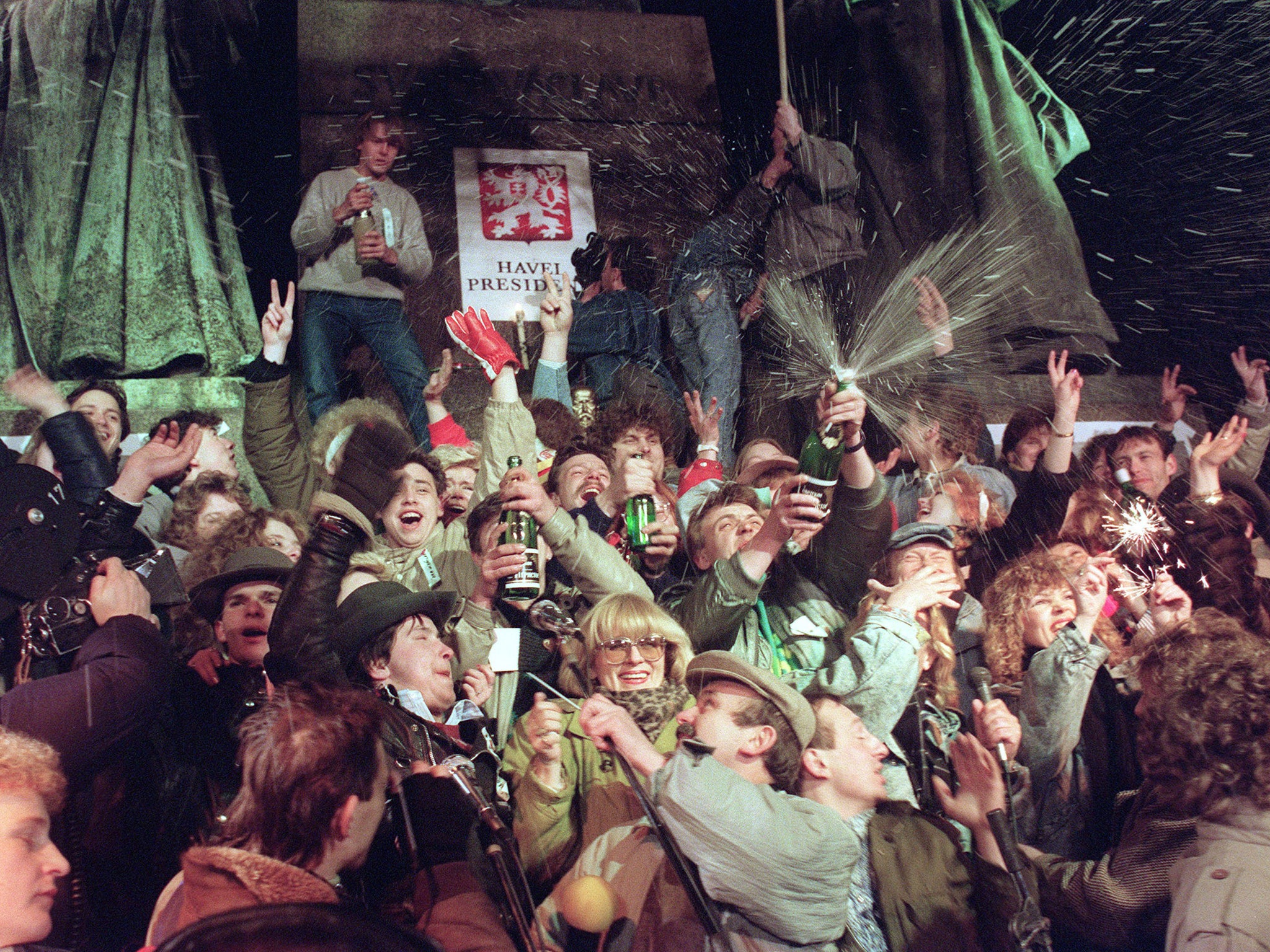 Young Czechoslovak people jubilate and spray champagne in support of Vaclav Havel for presidency