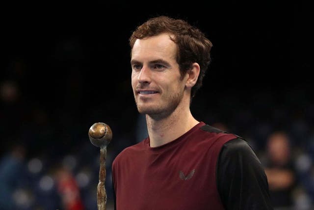 Andy Murray poses with the trophy after victory in Antwerp