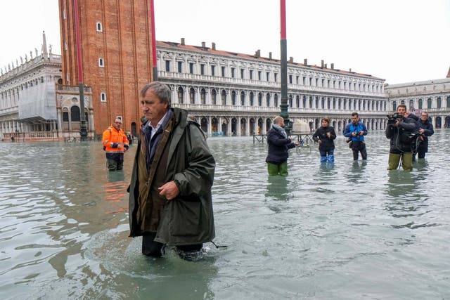 The mayor of Venice, Luigi Brugnaro, walks on St Mark's Square