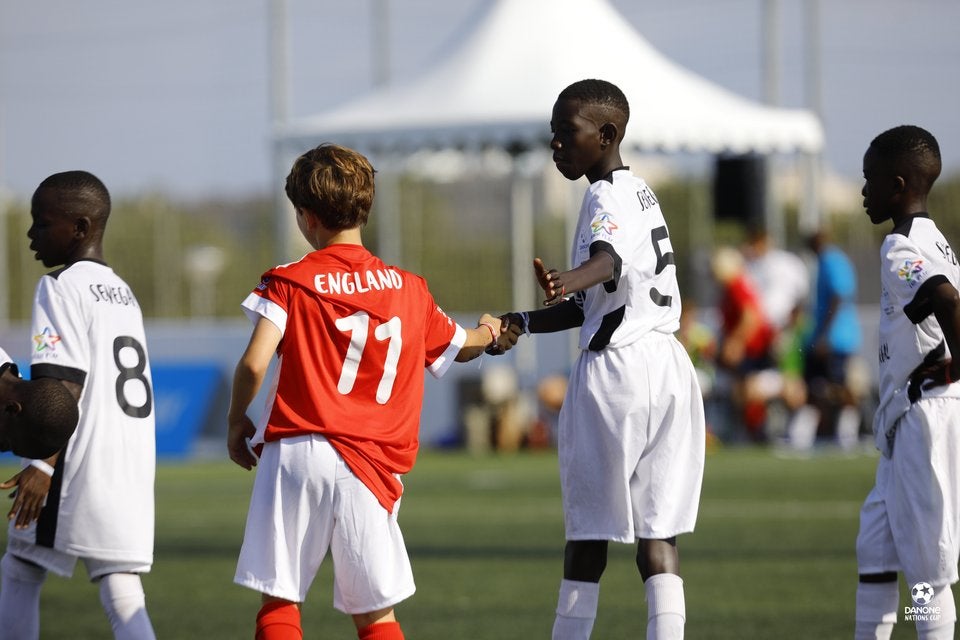 Players from England and Senegal shake hands