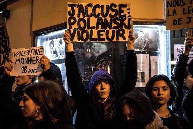 Banners reading 'I accuse: Polanski Rapist' could be seen during the protest