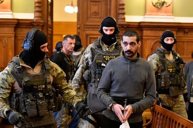 Syrian man identified as F Hassan, who is on trial for alleged terrorist activities, arrives at the Metropolitan Court in Budapest