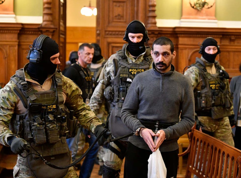 Syrian man identified as F Hassan, who is on trial for alleged terrorist activities, arrives at the Metropolitan Court in Budapest