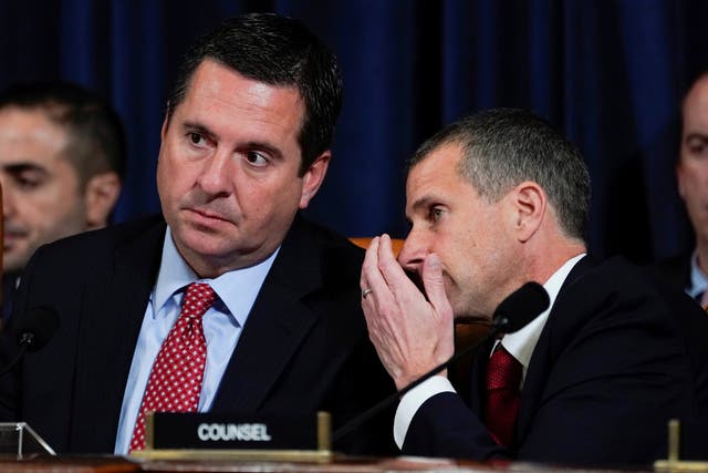 Republican counsel Steve Castor whispers to Devin Nunes during evidence by George Kent and William Taylor at the impeachment hearings into Donald Trump