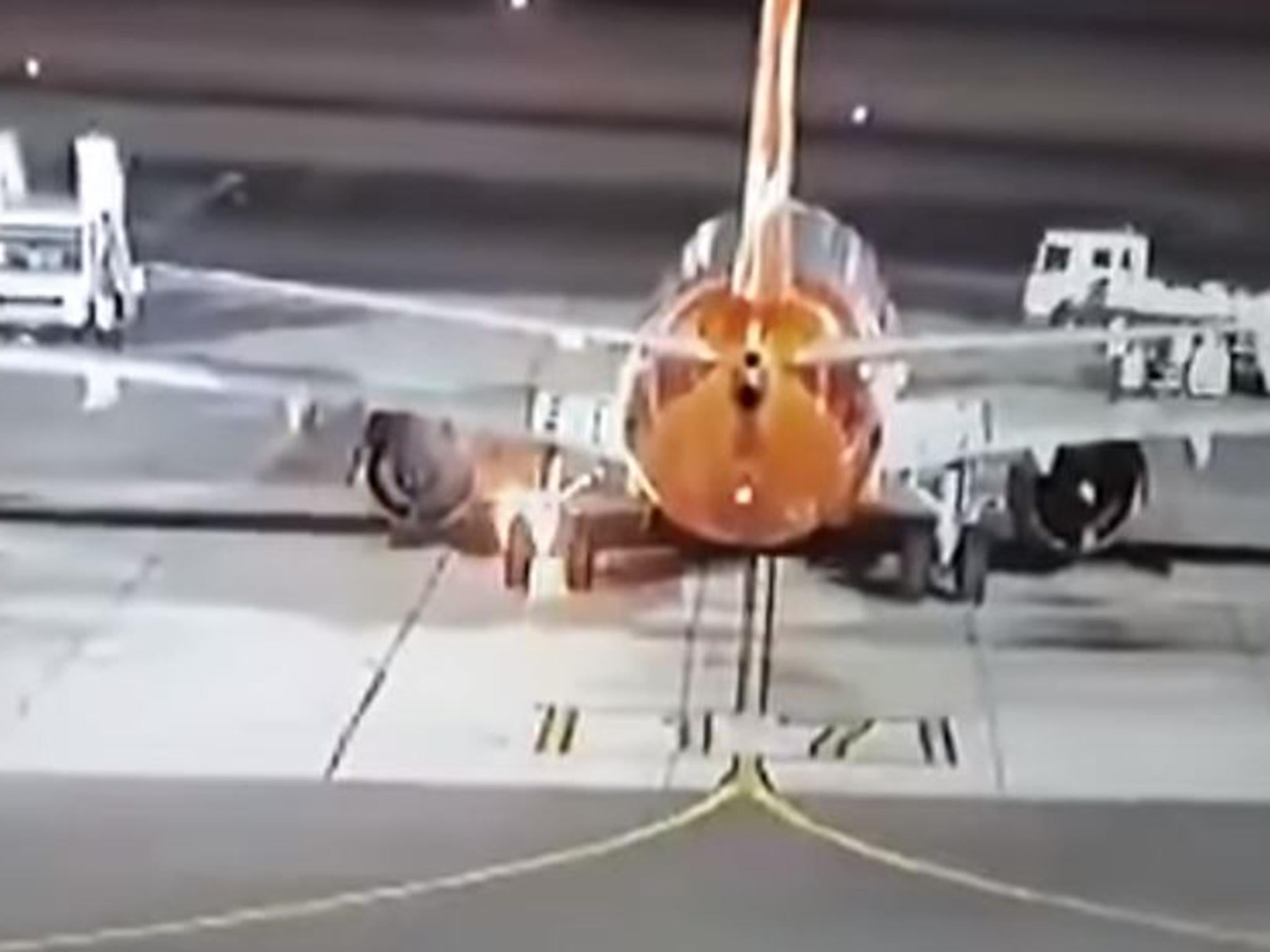 Plane&apos;s landing gear bursts into flames after touching down at airport