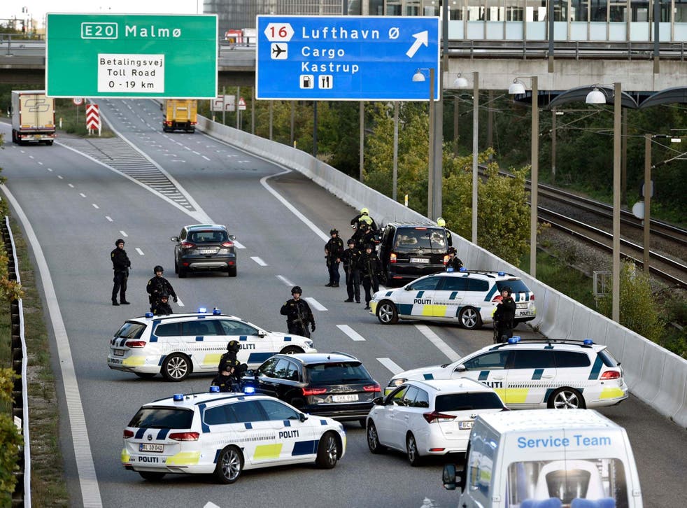 Police vehicles block a street near Copenhagen. Denmark has accused Iranian intelligence of planning to kill an activist on Danish soil