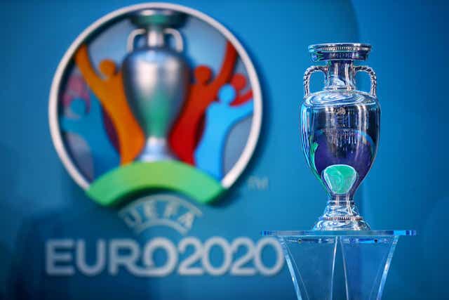 The European Championship trophy next to the logo for Euro 2020