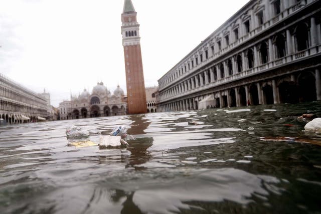 Rubbish floats in the flooded St Mark's Square on Friday, two days after the city suffered its second highest tide in recorded history