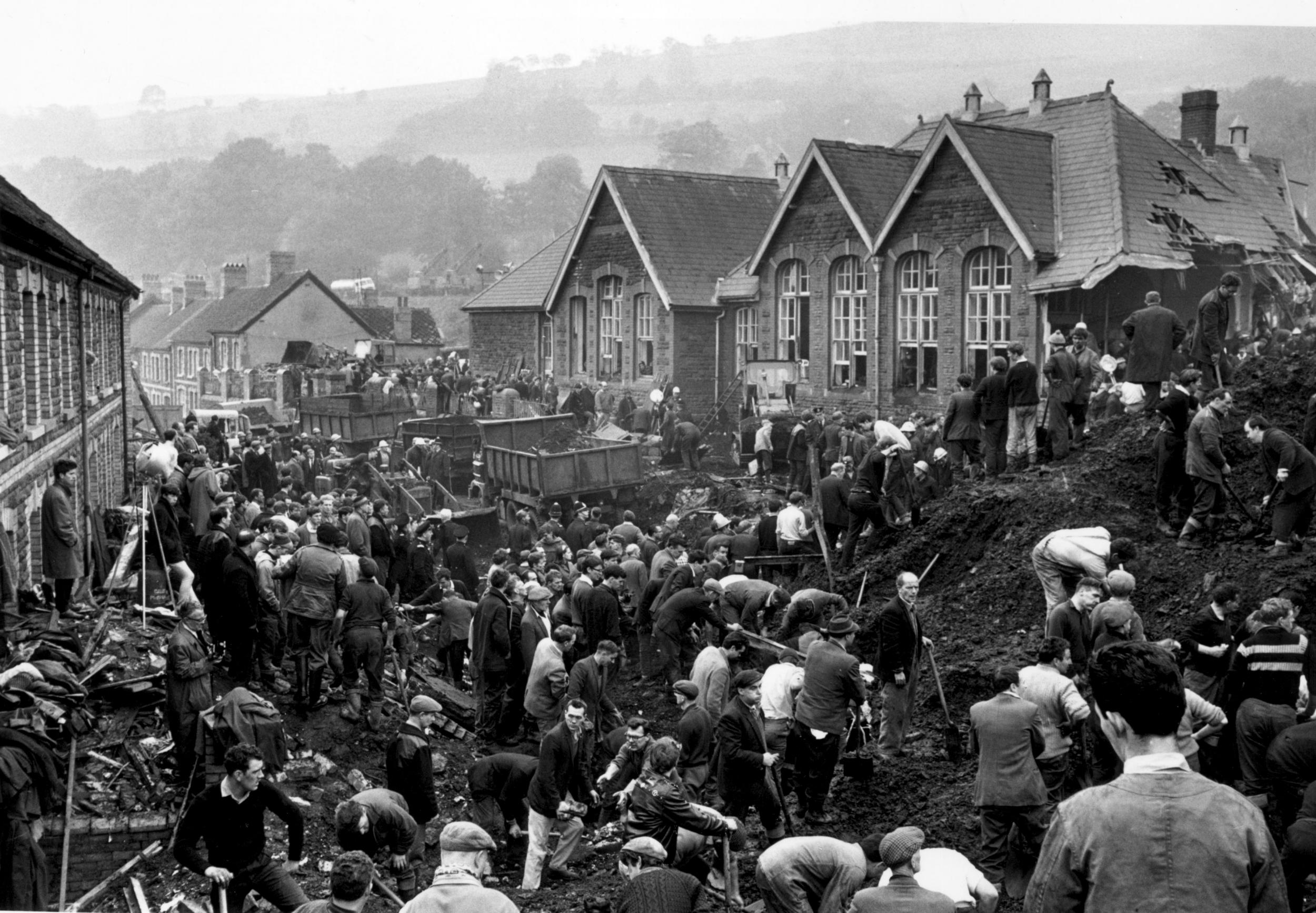 Rescue workers continue their search for victims of the Aberfan disaster, in South Wales, where 144 people lost their lives