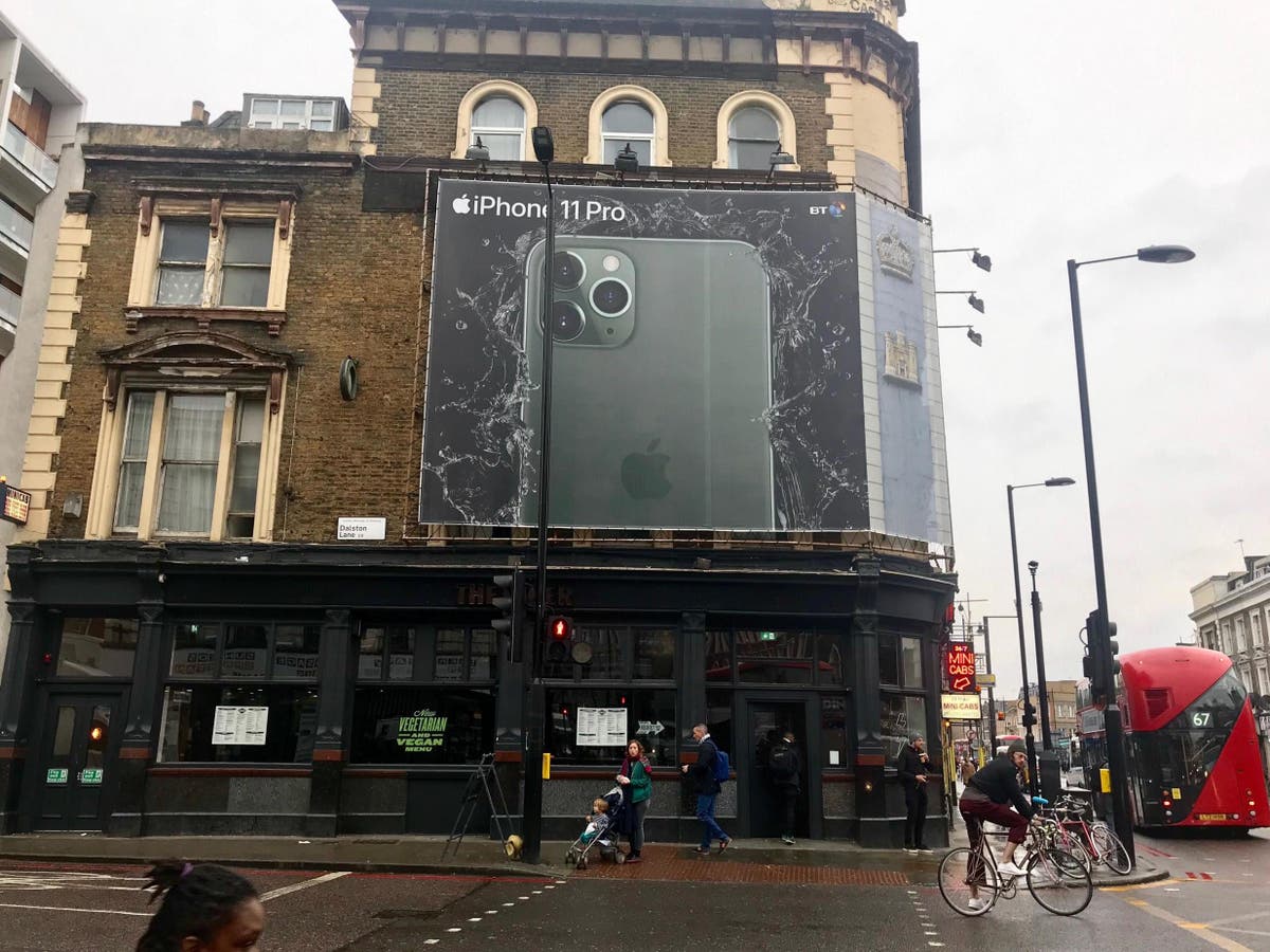 Night mode: Giant iPhone advert blocking out daylight to poverty-hit families in London apartment block