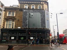 Giant iPhone advert blocking out daylight to poverty-hit families