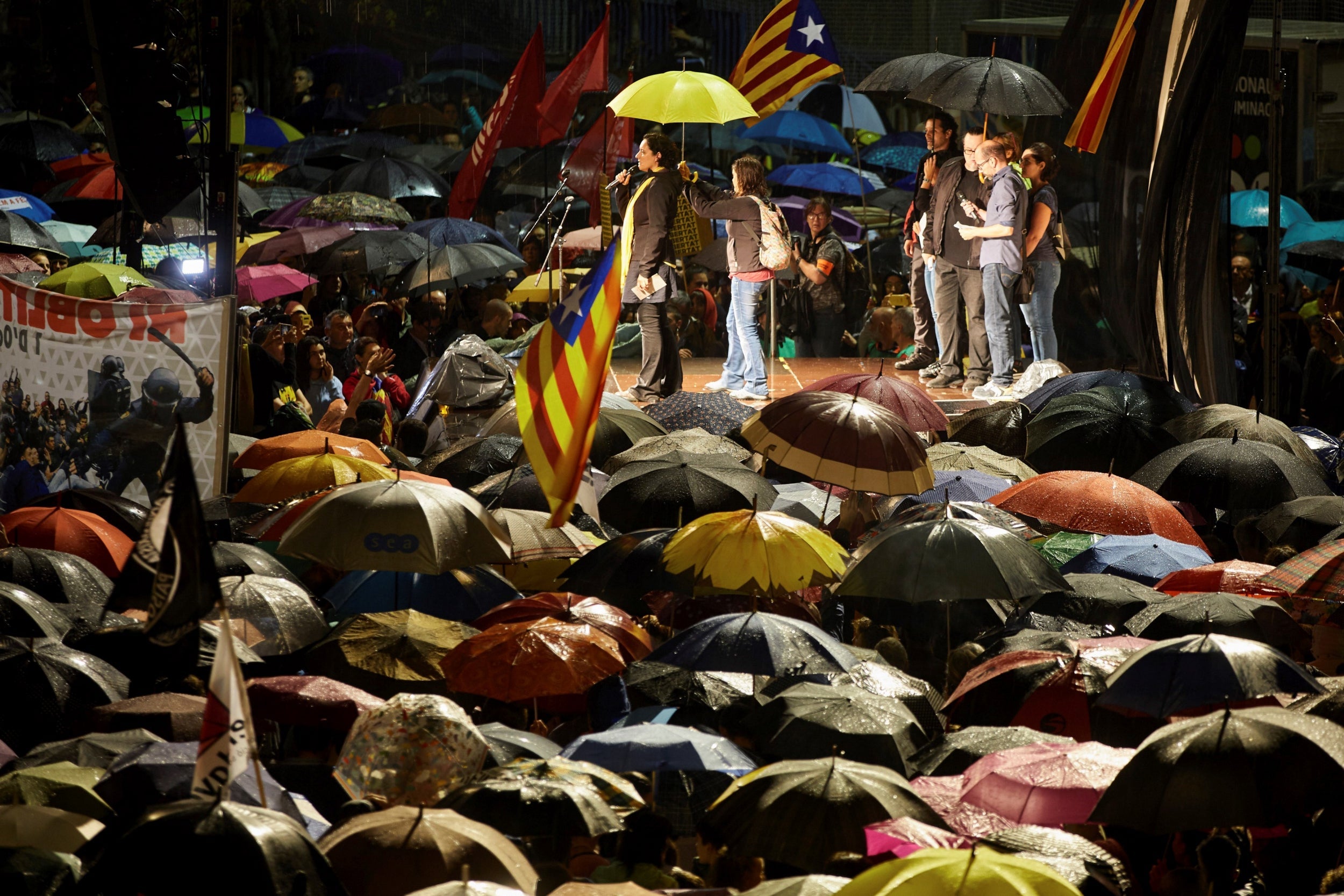 People attend a protest in Girona against the sentencing of independence leaders