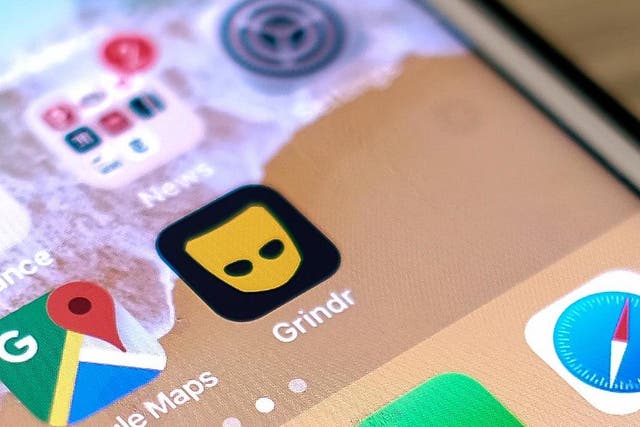 This picture taken on March 27, 2019 shows the Grindr app on a phone in Los Angeles