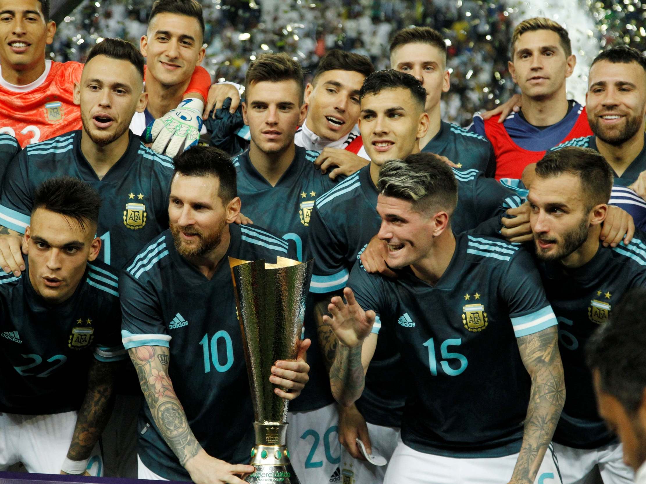 Messi lifts the trophy awarded to Argentina after victory against Brazil