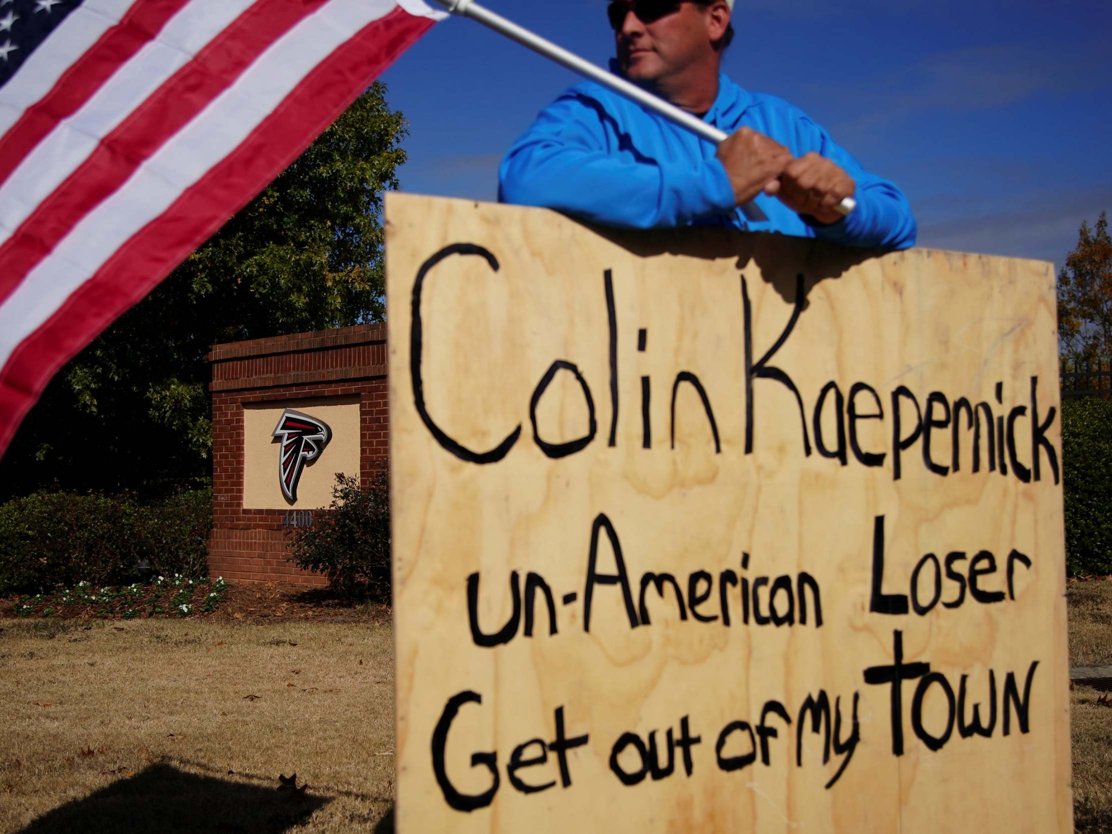 A protest stands by the Atlanta Falcons training facility