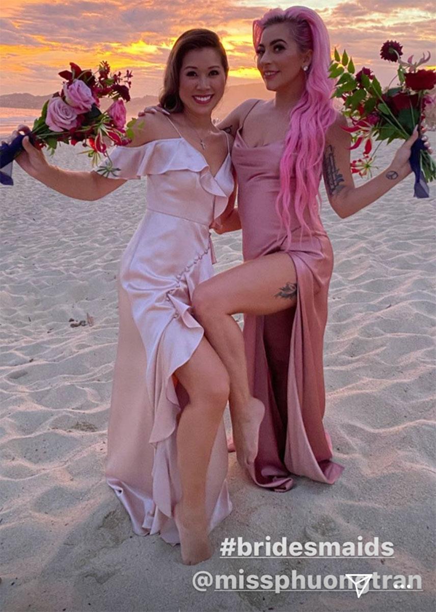 Lady Gaga poses on the beach alongside another bridesmaid (Instagram: @ladygaga)