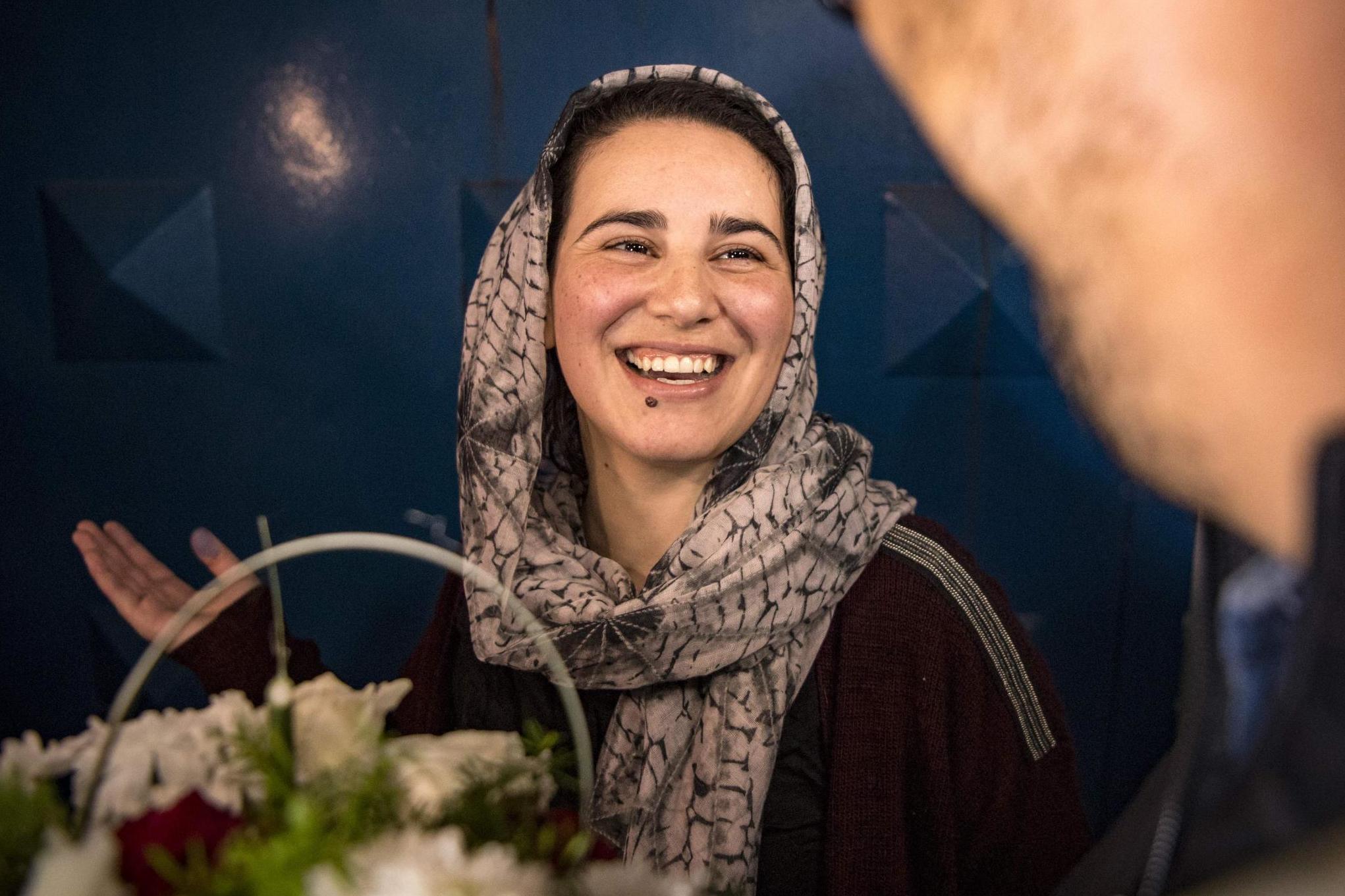 Hajar Raissouni is given flowers on her release from prison (AFP via Getty)