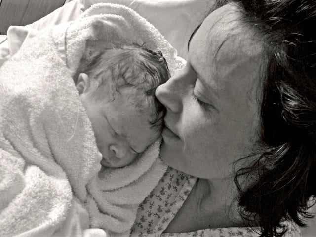 Kate Stanton-Davies pictured with her mother, Rhiannon, moments after her birth in March 2009