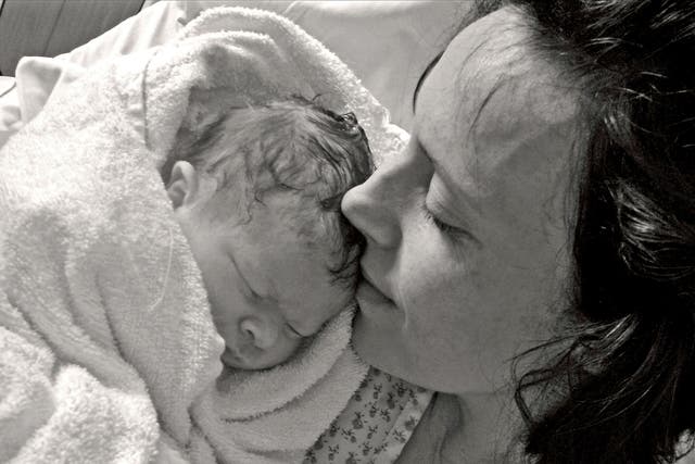 Kate Stanton-Davies pictured with her mother, Rhiannon, moments after her birth in March 2009