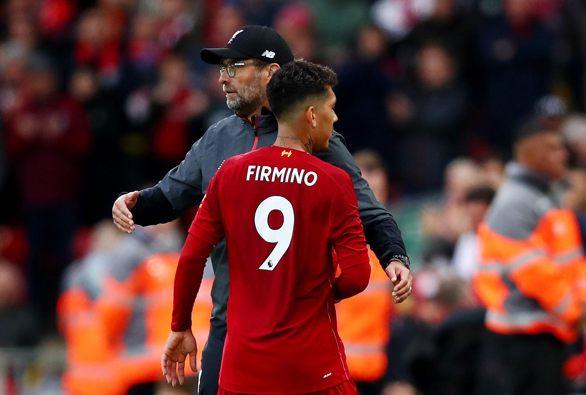 Firmino and Klopp embrace for Liverpool