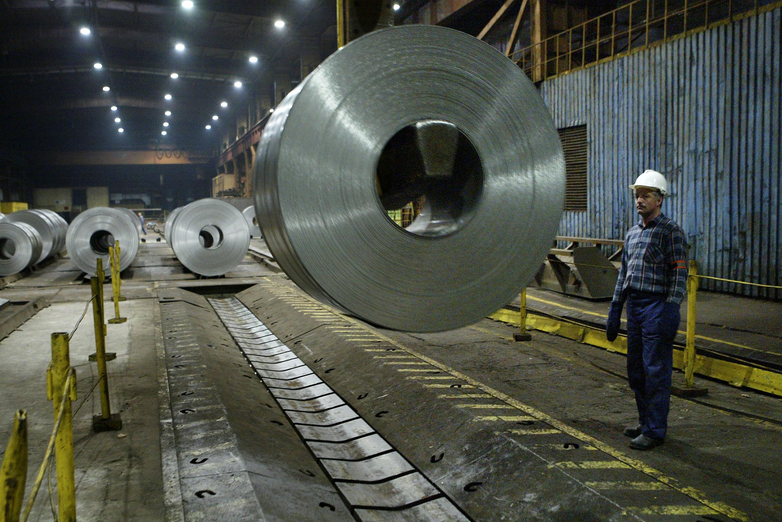 A worker oversees the transport of galvanised steel at Sendzimir (Getty)