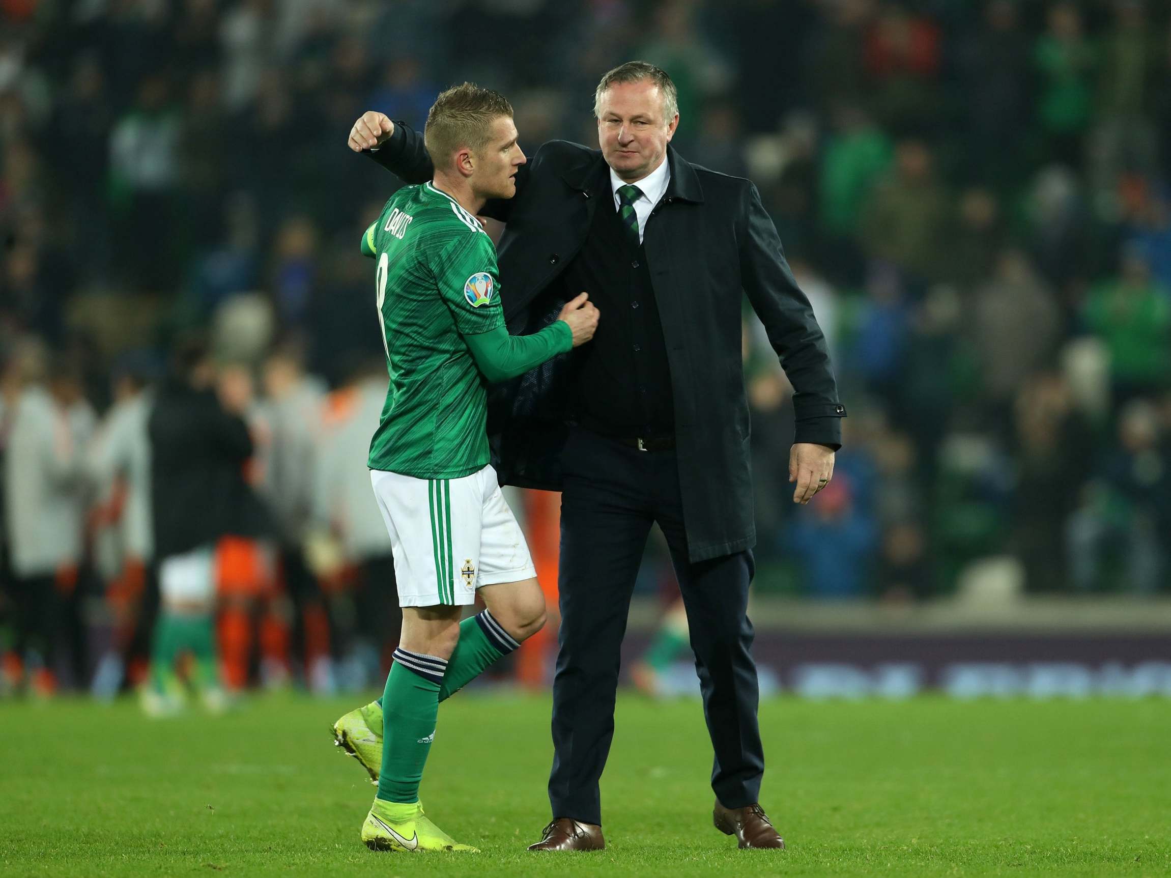 Northern Ireland's Steven Davis with manager Michael O'Neill