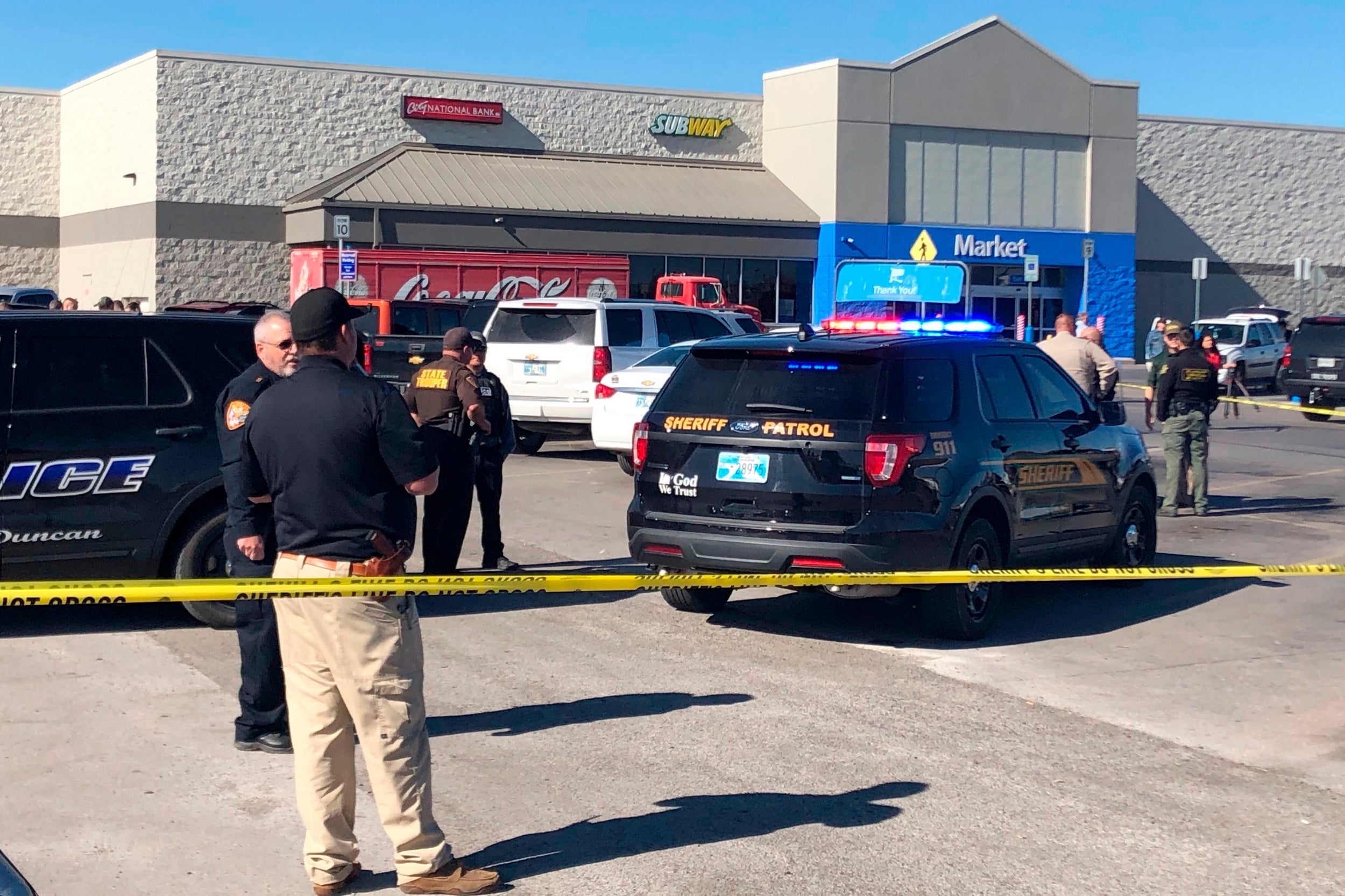 Police officers at the scene of a shooting at a Walmart in Duncan, Oklahoma