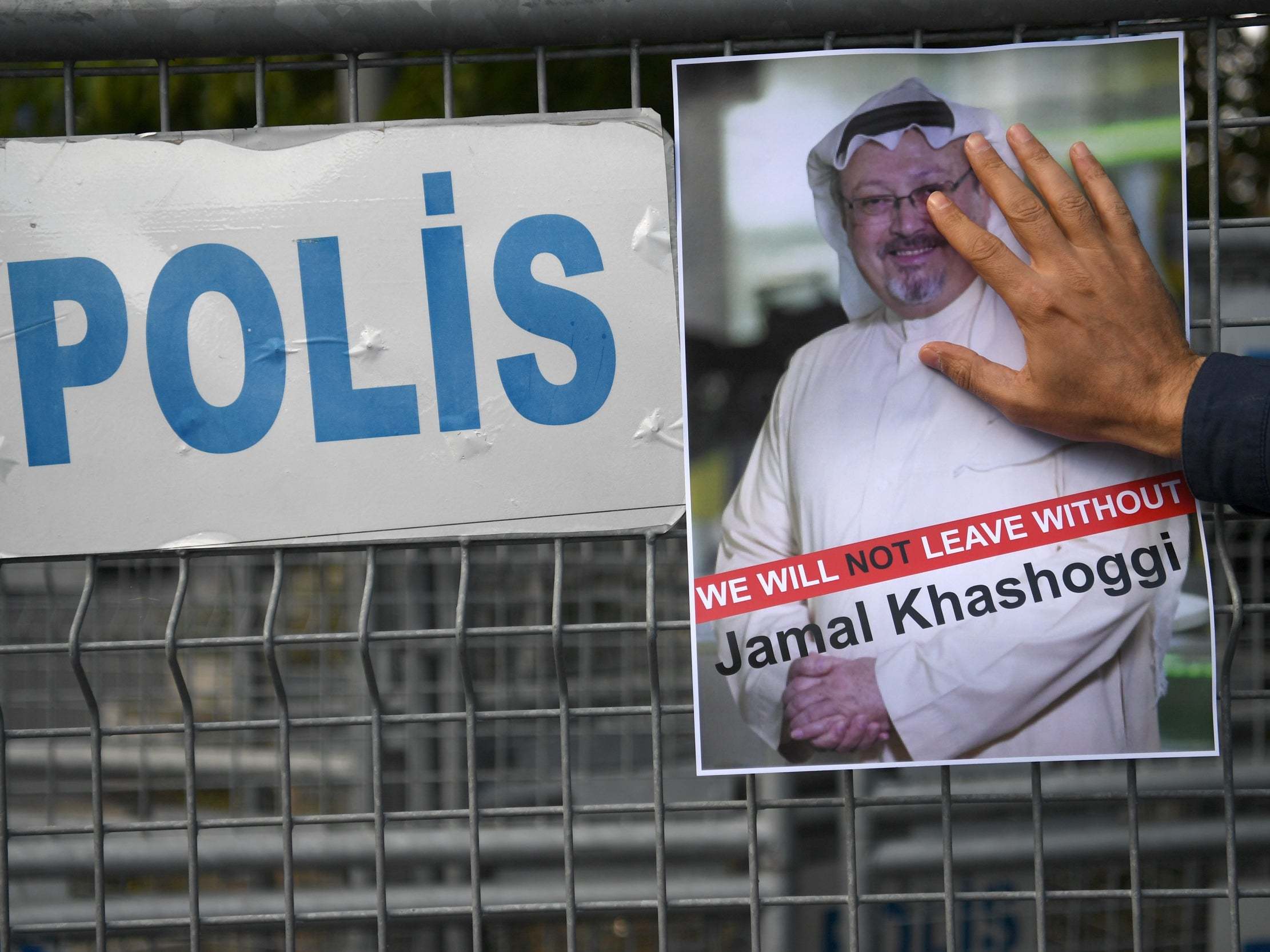 A protester holds a picture of Khashoggi outside the Saudi consulate in Istanbul after the news broke in October 2018