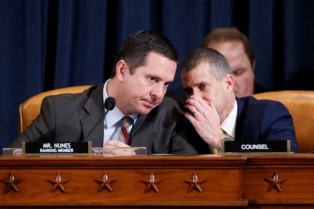 Devin Nunes, ranking Republican minority member on the House Intelligence Committee, confers with minority legal counsel Steve Castor during impeachment hearings