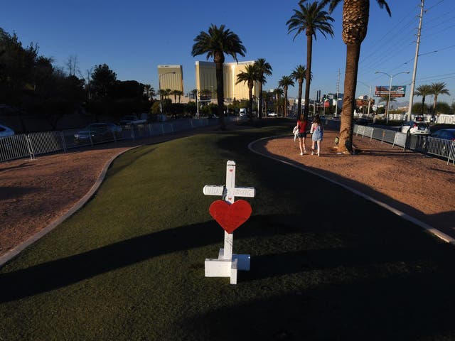 A solitary cross at a memorial site in front of the Mandalay Bay Hotel for the victims of the worst shooting in US history